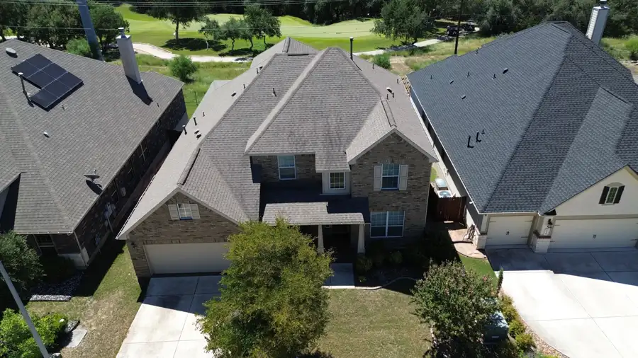 Two-story roof replacement by DNA Restoration & Construction