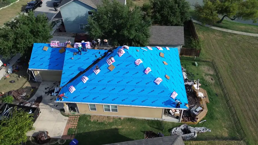 DNA crew replacing a hail-damaged roof in northeast Bexar County