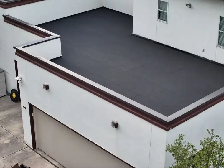 Flat roof coating system by DNA Restoration & Construction