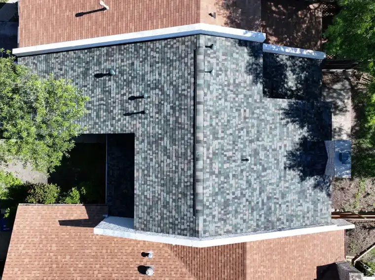 Designer shingle accent wall and roof by DNA Restoration & Construction
