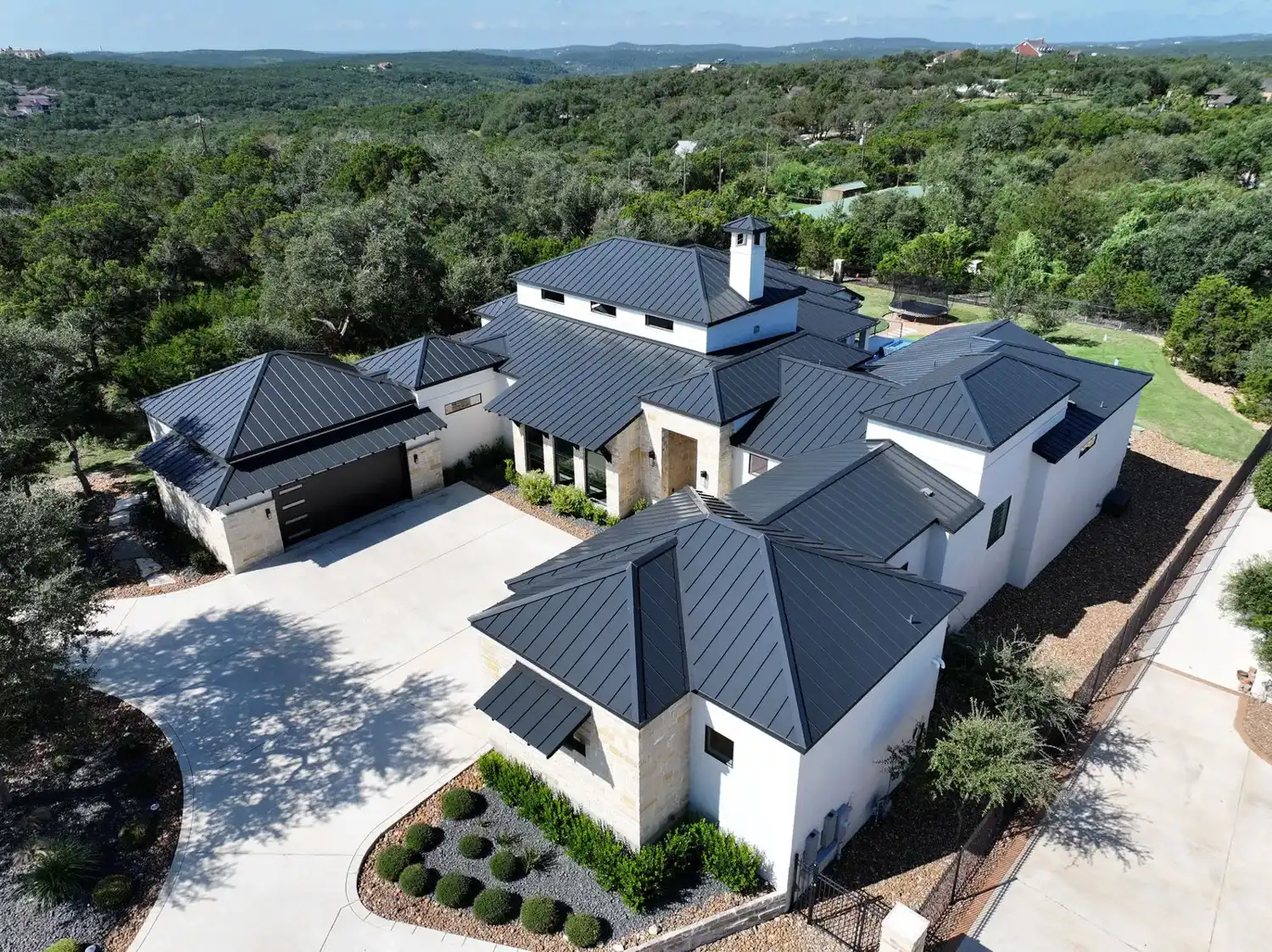 Drone photo of a San Antonio home with a new roof by DNA Restoration & Construction