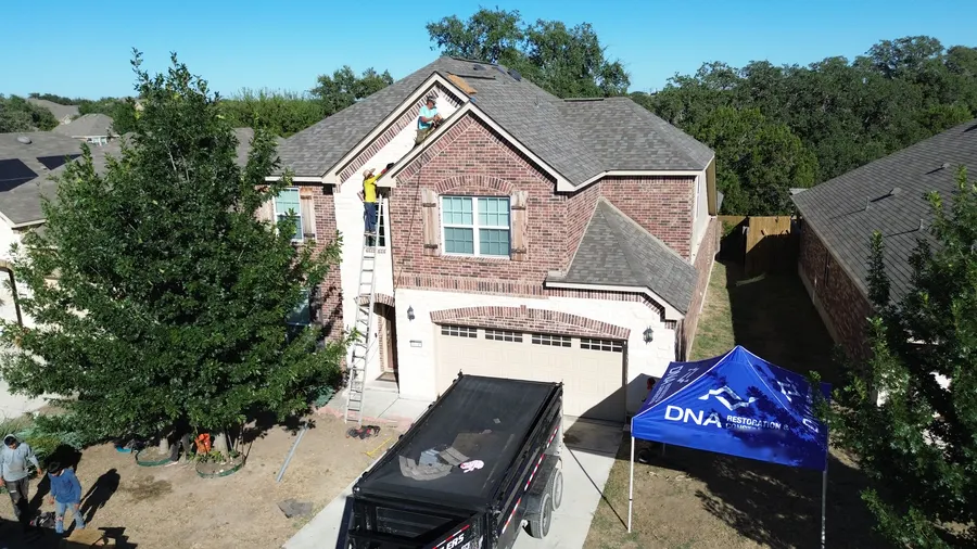 DNA Restoration & Construction roofing crew on a job near Schertz, TX