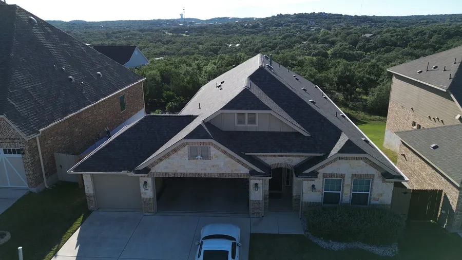 Finished roof with a Hill Country view by DNA Restoration & Construction